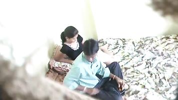 Indian lovers in bed kissing and the babe sucking the guys dick hesitantly before he gets between her legs and starts fucking.