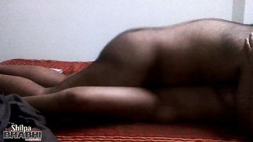 A magical bum administers a powerful aphrodisiac to a local housewife (Shilpa) when they have a hot casual encounter in a bedroom.